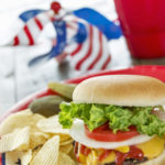 Loaded cheeseburger at a patriotic themed BBQ